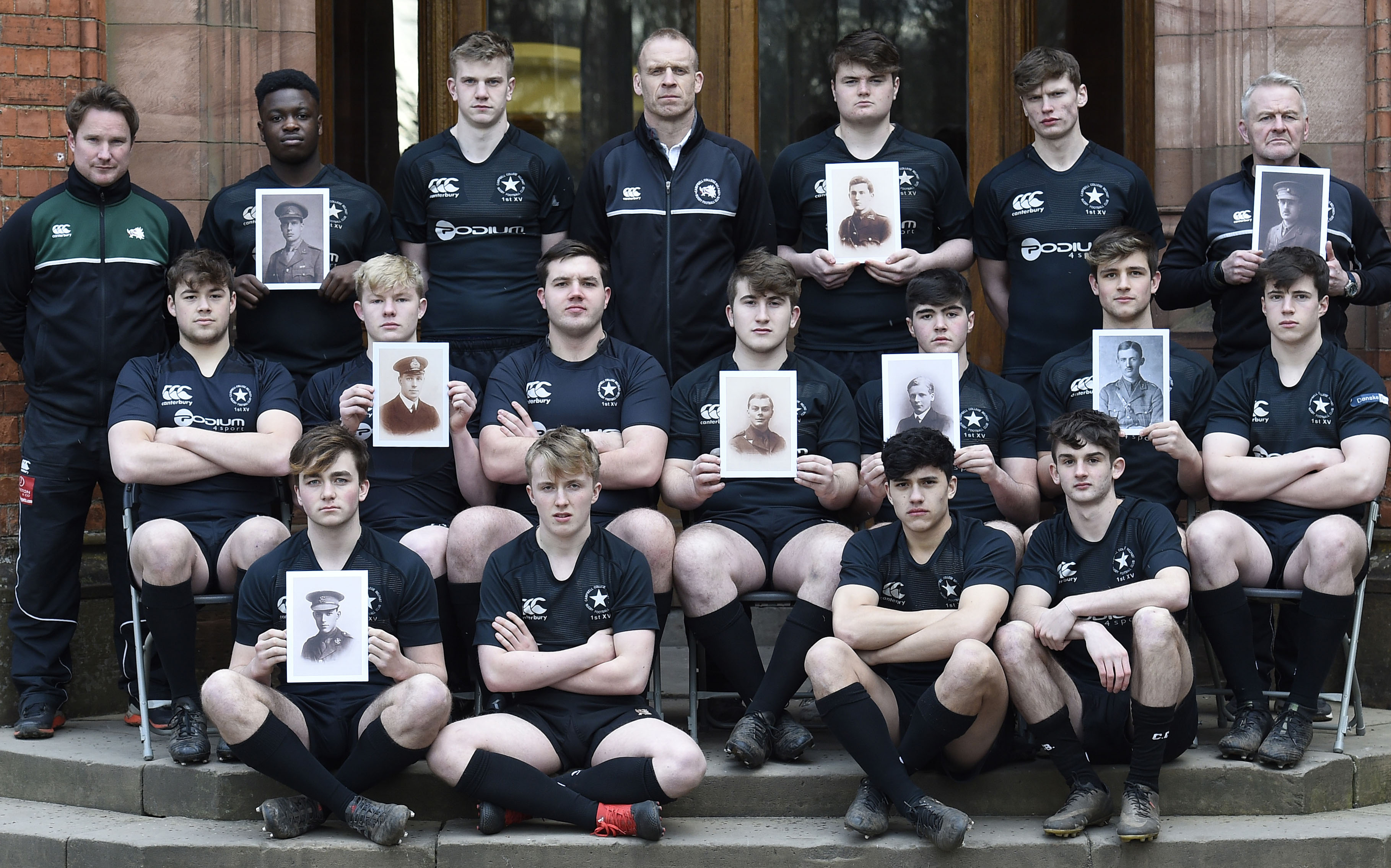 CCB’s current rugby 1st XV holding images of the seven members of the 1913-4 1st XV, including George Herriot, killed in the Great War